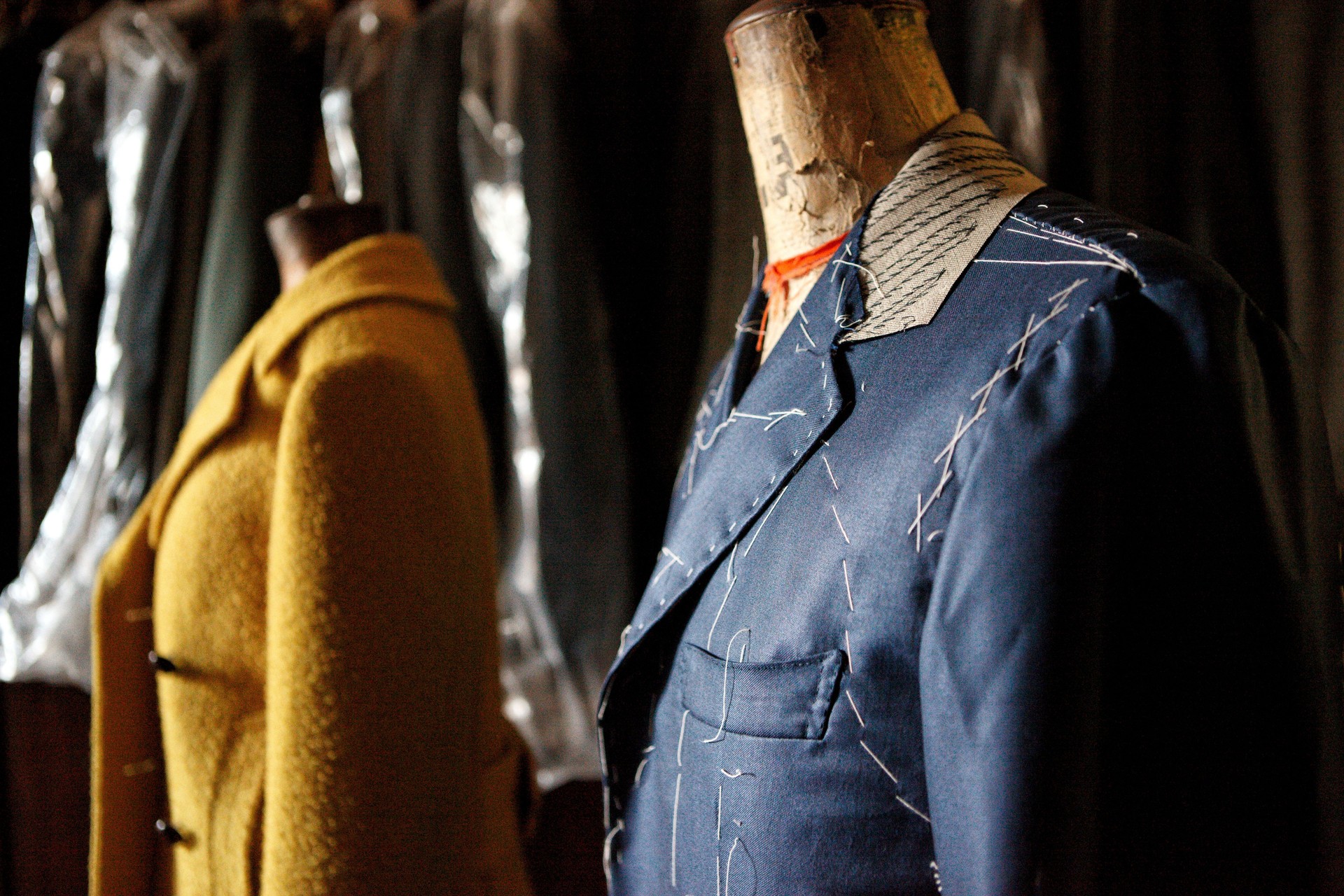 Rear View Of Male Mannequin Standing Against Wall
